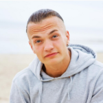 Screenshot-2025-03-13-at-08-28-50-Free-Photo-Portrait-of-man-posing-on-the-beach-in-a-grey-coat-150x150.png